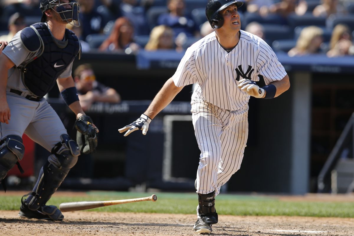 Mariners catcher Mike Zunino, left, can only watch Yankees Mark Teixeira’s eighth-inning, tie-breaking solo home run. (Associated Press)