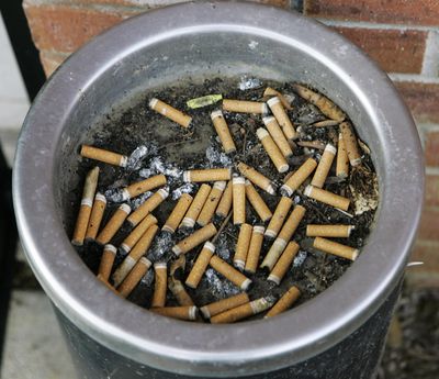 An ashtray full of cigarette butts is shown in Omaha, Neb., in this March 28, 2007 file photo. (Nati Harnik / Associated Press)