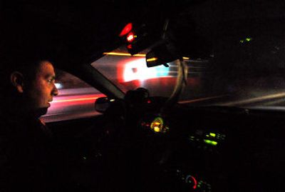 
Coeur d'Alene tribal police Officer Cody Sijohn patrols U.S. 95 in Tensed, Idaho, on Wednesday night. Sijohn and the rest of the dozen patrol officers at the tribal police department are cross-deputized to enforce Kootenai and Benewah counties' laws, as well as tribal laws. 
 (Jesse Tinsley / The Spokesman-Review)