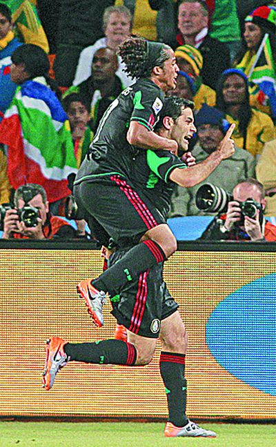 Mexico's Rafael Marquez, bottom, celebrates his goal. (Associated Press)