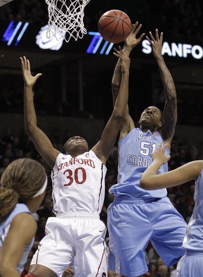 Stanford’s Nnemkadi Ogwumike, left, and North Carolina’s Jessica Breland right for a rebound in the first half. (Associated Press)