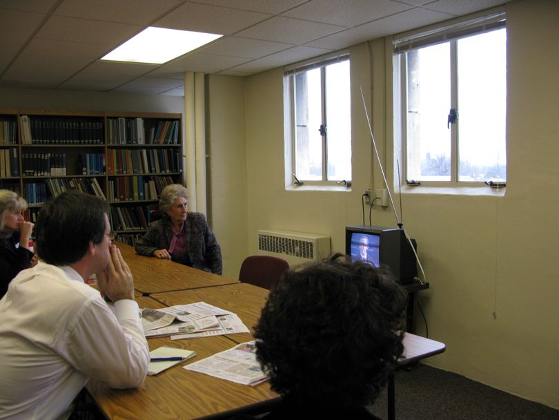 A few Idaho state lawmakers and Capitol Annex staffers gathered to watch the presidential inauguration on a small, scratchy TV in the annex's library, 1/20/09 (Betsy Russell / The Spokesman-Review)