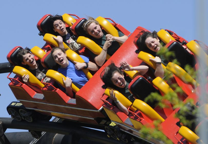 Students ride the Corkscrew roller coaster at Silverwood Theme Park last year. The park’s attendance has stayed strong through the economic downturn. (File)