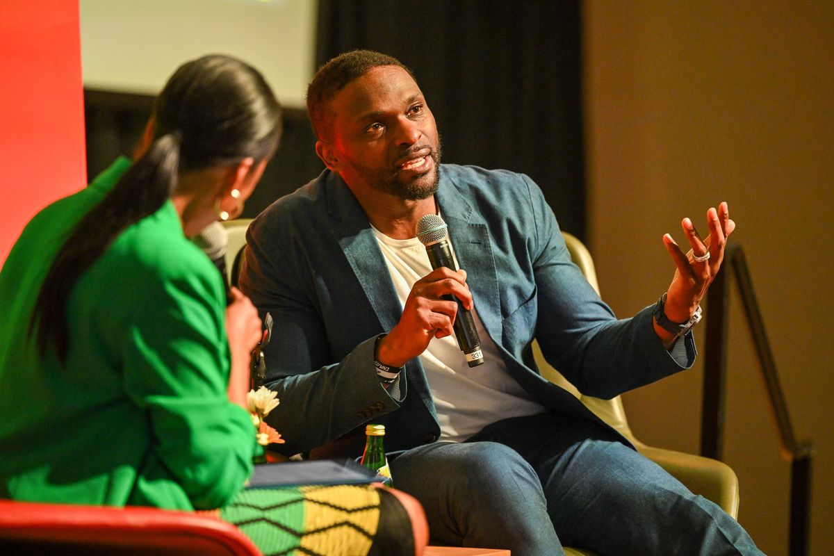 Former Seattle Seahawk Cliff Avril talks with Spokane NAACP President Lisa Gardner, left, at an event called the Juneteenth Fireside Chat Thursday, June 19, 2025 at Gonzaga University. The former NFL tight end is now a real estate develop and philanthropist. (Jesse Tinsley/THE SPOKESMAN-REVIEW)