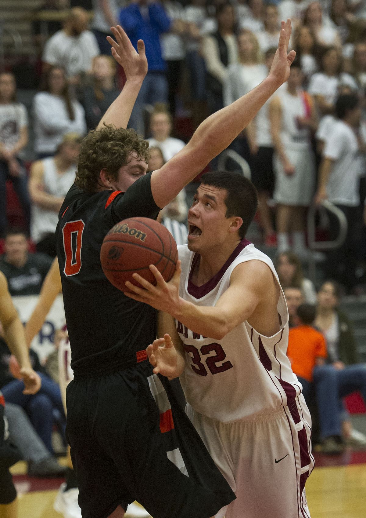 Whitworth’s George Valle, who had a key steal and layup in the early going, shoots underhand against the Pioneers’ defense. (Colin Mulvany)