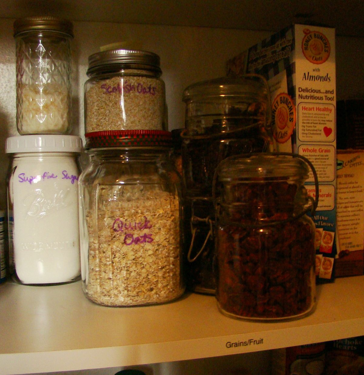 Use glass jars to store bulk items in the pantry to keep food fresh. Sharpie marker is great for labeling: it stays on the jar when you need it and erases easily with a little rubbing alcohol. (Maggie Bullock)