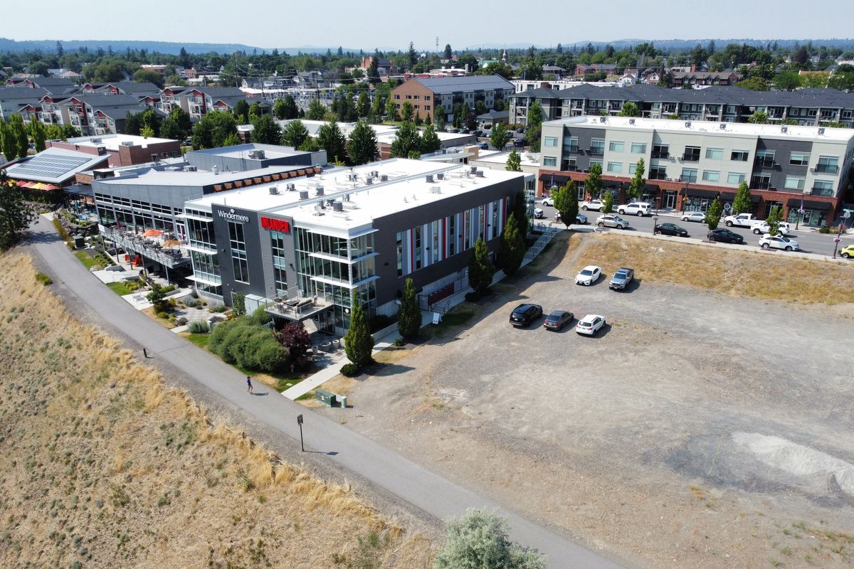 Greenstone is planning a new six-story multi-use retail/residential building on the empty land east of the Inlander offices in Kendall Yards, shown Wednesday, July 10, 2024, in Spokane, Washington.  (Jesse Tinsley/THE SPOKESMAN-REVIEW)