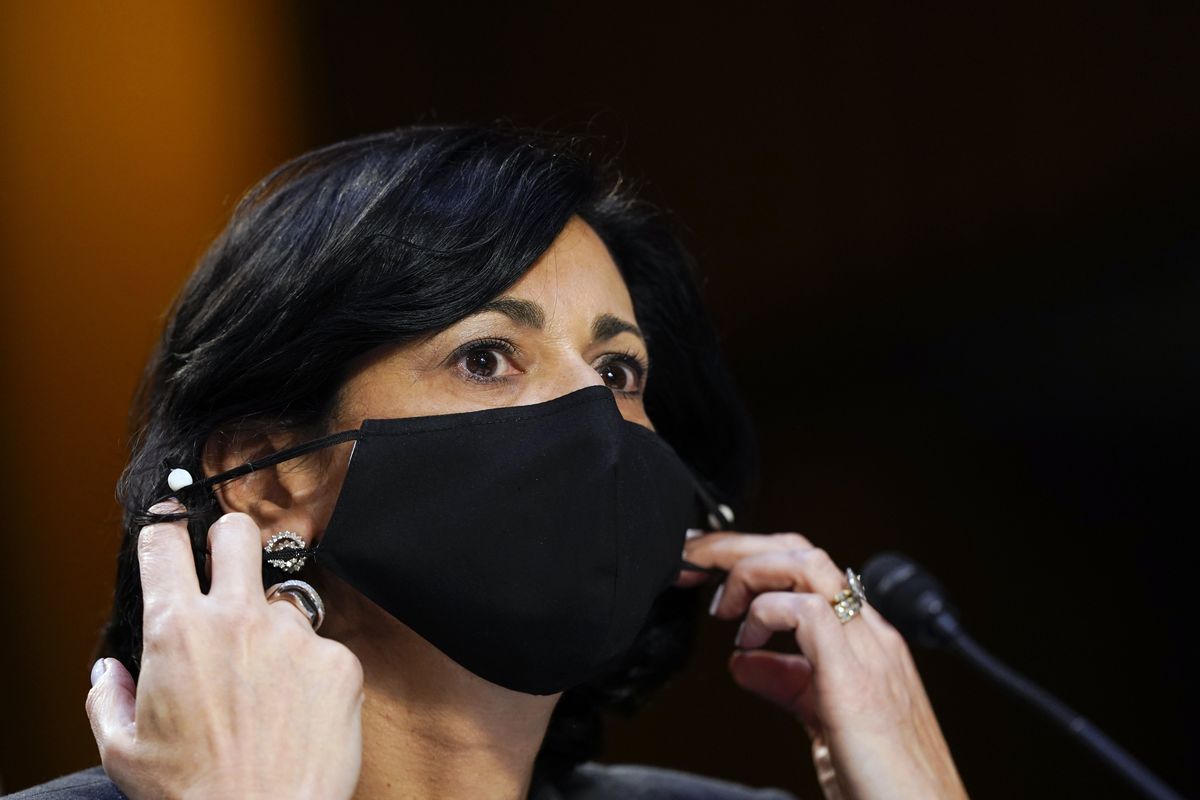 FILE - Dr. Rochelle Walensky, director of the Centers for Disease Control and Prevention, adjusts her face mask during a Senate Health, Education, Labor and Pensions Committee hearing on the federal coronavirus response on Capitol Hill in Washington, in this Thursday, March 18, 2021, file photo. Walensky says new mask-wearing guidance, coupled with higher rates of vaccination against COVID-19, could halt the current escalation of infections in “a couple of weeks.” The director of the Centers for Disease Control and Prevention told “CBS This Morning” she hopes more stringent mask-wearing guidelines and other measures won’t be necessary as the country heads into the fall.  (Susan Walsh)