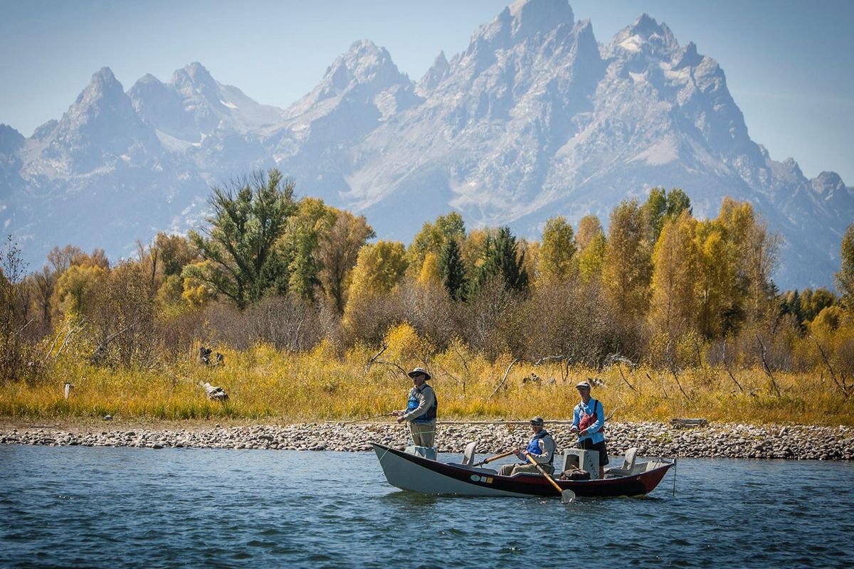 Fly fishers in the annual One-Fly fishing tournament out of Jackson Hole, Wyoming, drift on the South Fork Snake River with the Grand Tetons in the background. (Photo by Neal Henderson/Reaction / Photo by Neal Henderson/Reaction)