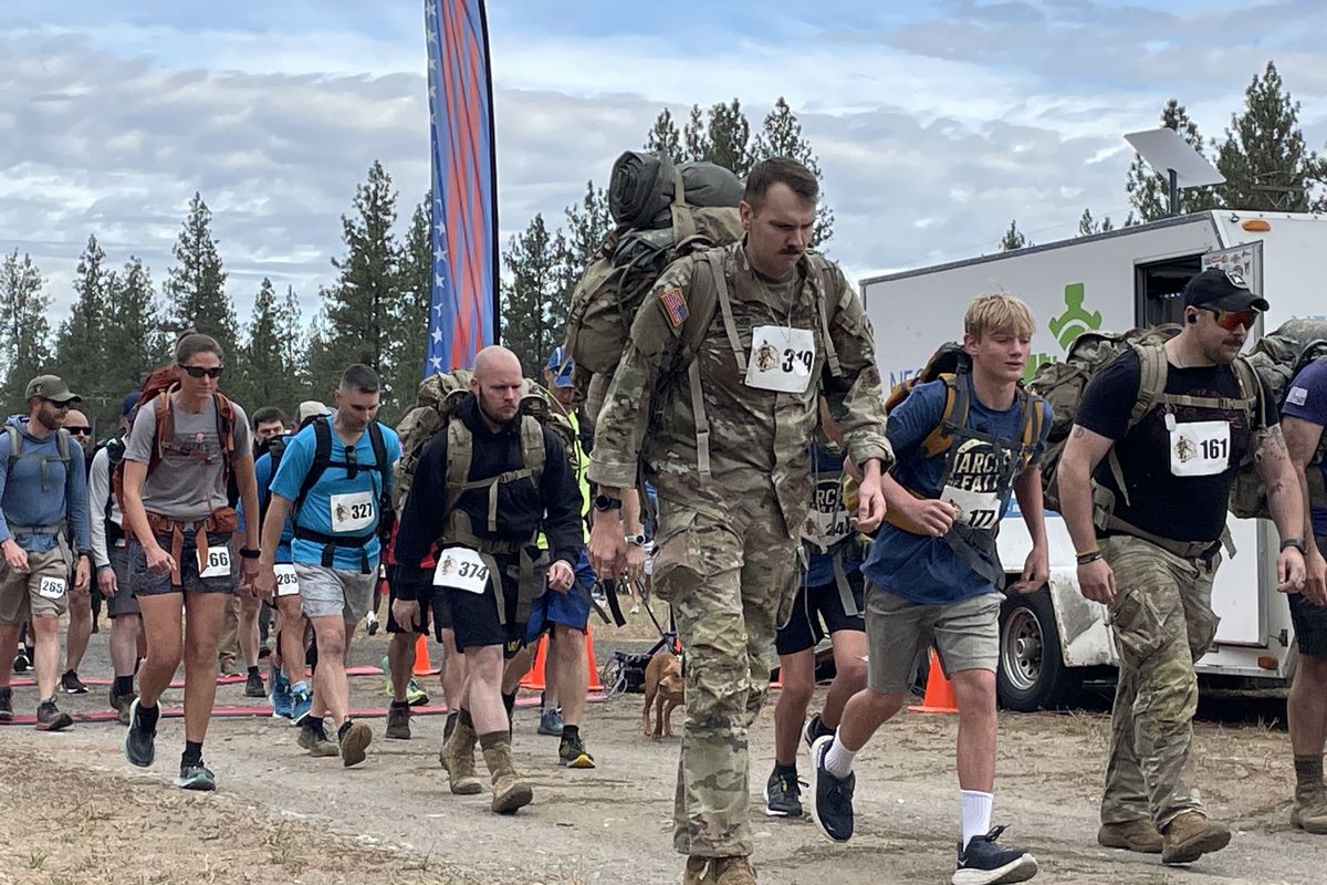 Participants in March for the Fallen start their hike Saturday at Riverside State Park to honor veterans who lost their lives after 9/11.  (Garrett Cabeza / The Spokesman-Review)