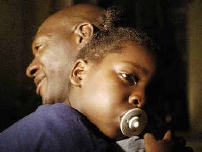 Yankees' pitcher Jose Contreras, left, holds his daughter, Naylenis, while talking to reporters in Miami Beach, Fla.
(Associated Press / The Spokesman-Review)