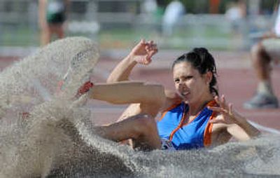 
Boise State's Eleni Kafourou lands in the sand pit during WAC triple jump competition. Associated Press
 (Associated Press / The Spokesman-Review)