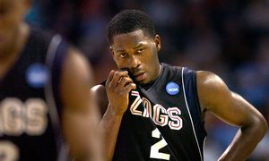 Jeremy Pargo of Gonzaga shows the strain of defeat as he wipes the sweat from his face in the final minutes of his final game for Gonzaga.  (Christopher Anderson / The Spokesman-Review)