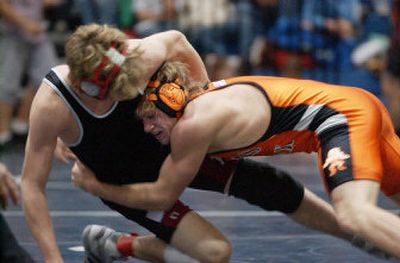 
Lewis and Clark's Anthony Varnell, right, makes a move against North Central's Dan Siebert on his way to the 140-pound title at Central Valley on Saturday. .
 (Kathryn Stevens / The Spokesman-Review)