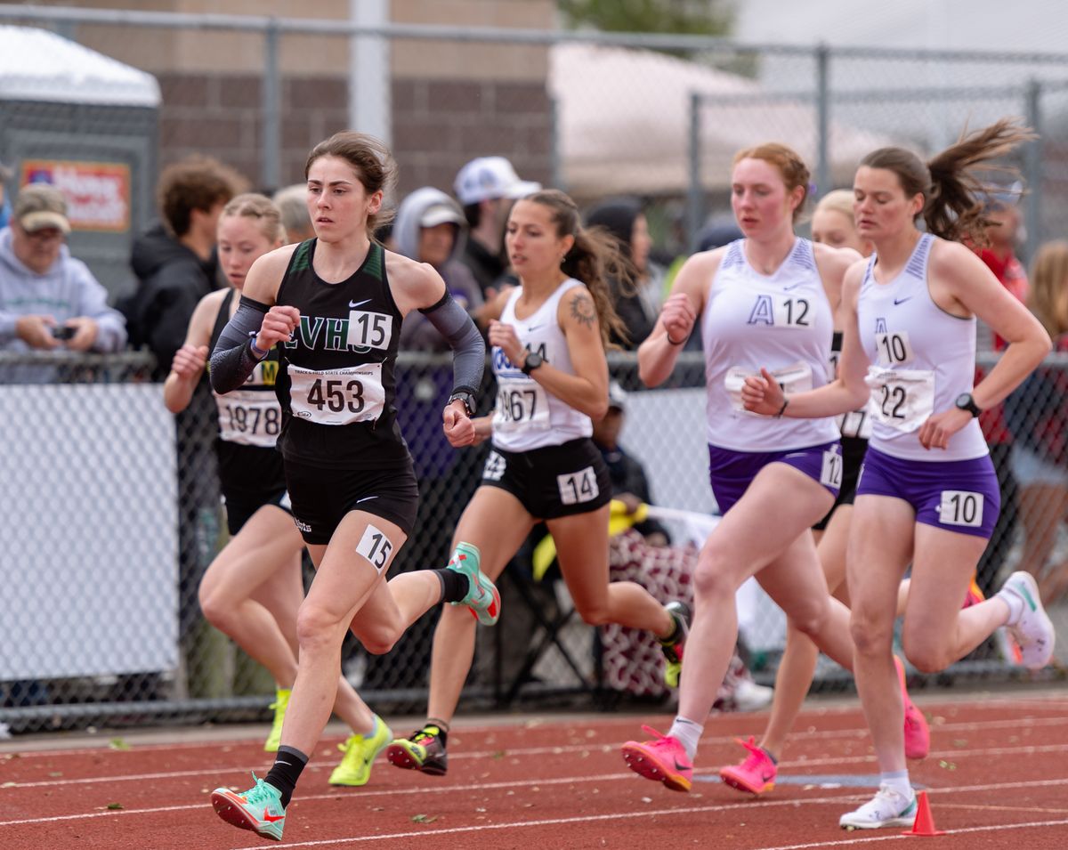 East Valley’s Logan Hofstee leads the pack off the starting gun to begin the State 2A girls 3,200-meter run Saturday at Mount Tahoma High School in Tacoma. Hofstee finished with a meet-record time of 10 minutes, 28.66 seconds.  (Joshua Hart/For The Spokesman-Review)