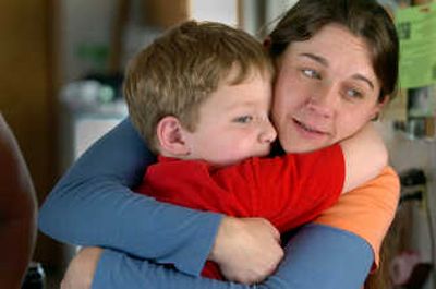 
Tammi Nichols embraces her son Caleb, 5. 