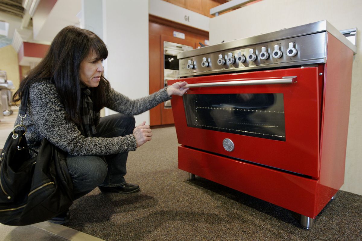 Brenda Knehans of Shawnee, Mo., checks out the latest in a six-burner, 36-inch Bertazzoni range at Nebraska Furniture Mart. The commercial-style home appliance retails for $4,699, though a more standard size from the line can be found for around $2,000. McClatchy-Tribune (McClatchy-Tribune)