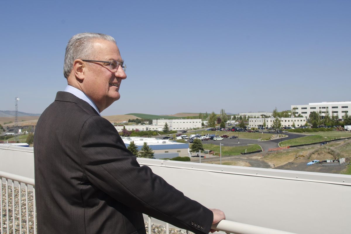 Edmund Schweitzer, a second-generation electrical engineer and inventor, looks out over the growing campus of Schweitzer Engineering Laboratories, a company in Pullman that has experienced explosive growth in recent years. Schweitzer is still actively inventing equipment for electrical power handling. Photographed Tuesday, April 19, 2016. (Jesse Tinsley / The Spokesman-Review)