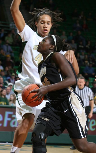 Idaho’s Yinka Olorunnife tries to get past 6-foot-8 Baylor center Brittney Griner during the Baylor tournament last week in Waco, Texas.  (Associated Press)