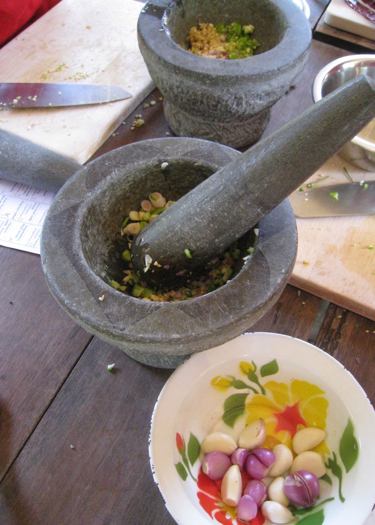 Fresh herbs and spices are ground into a smooth paste with a mortar and pestle. (Courtesy Harrington / The Spokesman-Review)