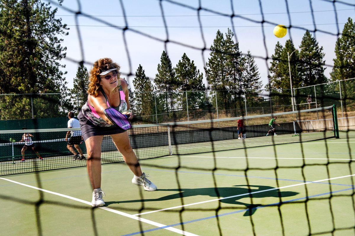 Coeur d’Alene resident Letha Rodrigues plays pickleball at Cherry Hill Park in Coeur d’Alene on Aug. 12. The sport, a combination of tennis, badminton and Ping-Pong, is becoming popular in Coeur d’Alene. Rodrigues started playing three years ago. (Kathy Plonka)