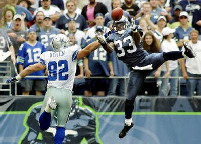 
Seattle's Marquand Manuel breaks up a pass intended for Dallas' Jason Witten during a Monday night game last season. 
 (File/Associated Press / The Spokesman-Review)