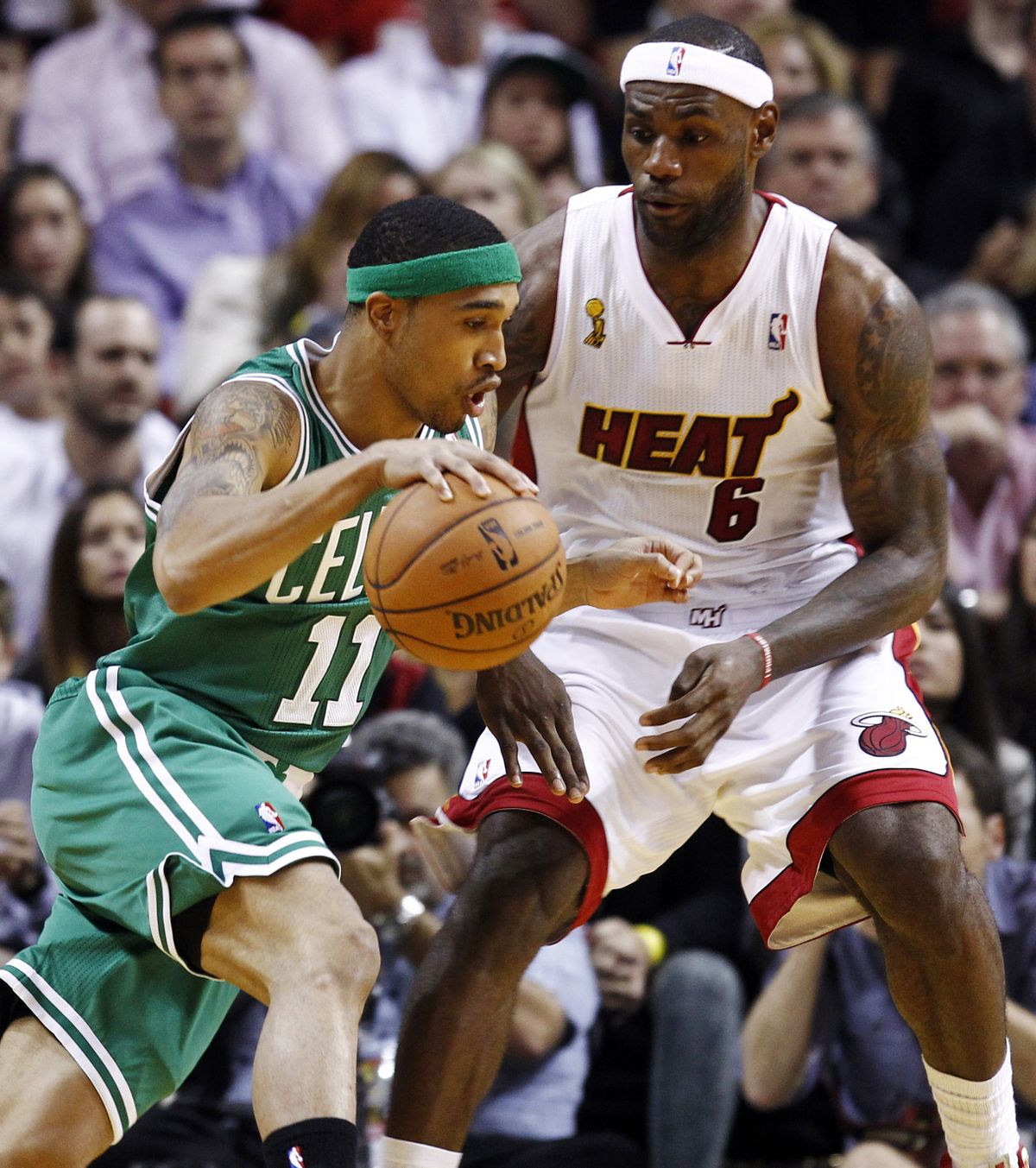 LeBron James (6) keeps defensive heat on Boston’s Courtney Lee during first half. (Associated Press)