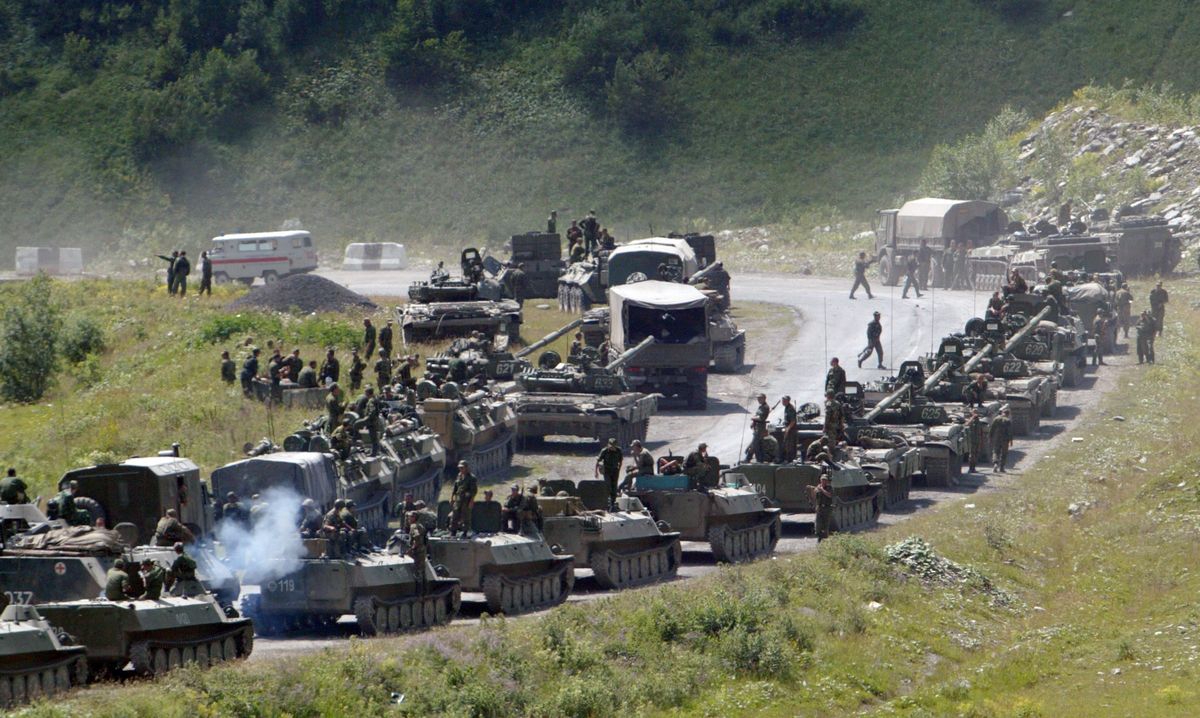 A column of Russian armored vehicles moves toward the South Ossetian capital Tskhinvali on Saturday.  (Associated Press / The Spokesman-Review)