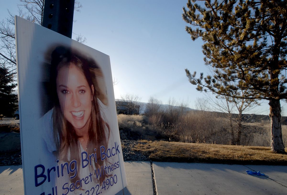 A sign posted near a field in Reno asks for help finding 19-year- old Brianna Denison in February.  (File Associated Press / The Spokesman-Review)