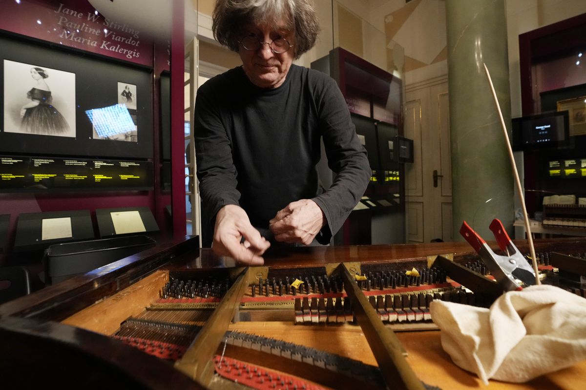Texas-born expert on historic pianos, Paul McNulty, renovates the last piano that Frederic Chopin played and composed on, at the Chopin museum in Warsaw, Poland, on Thursday, Dec. 9, 2021. The 1848 Pleyel piano was offered to Chopin
