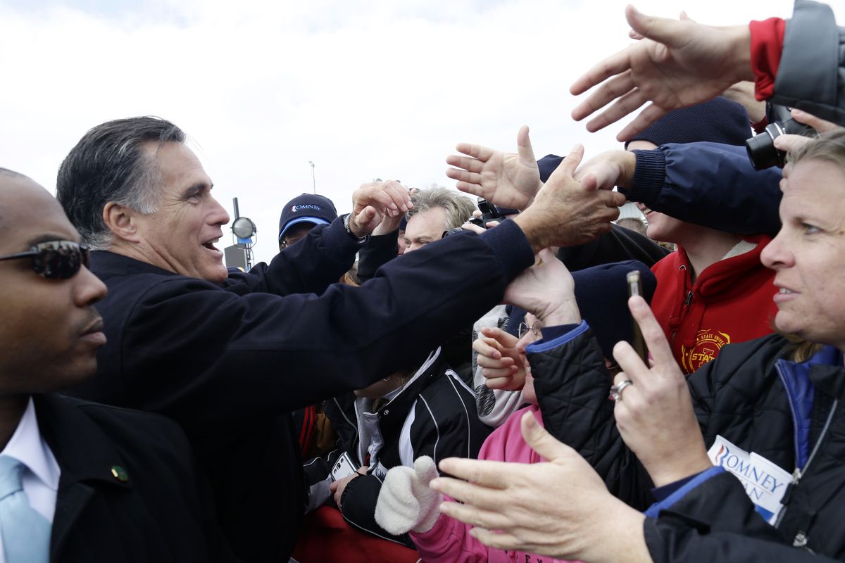 Republican presidential candidate, former Massachusetts Gov. Mitt Romney greets supporters after he spoke about the economy at a campaign rally at Kinzler Construction Services in Ames, Iowa, Friday, Oct. 26, 2012. (Charles Dharapak / Associated Press)