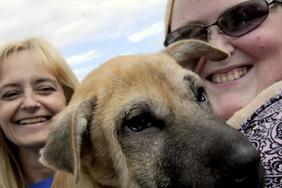 Bonnie Whiting, left, and Jenn Pearce  rescued Hannah and several other dogs from death row shelters in Southern California.  (Kathy Plonka / The Spokesman-Review)