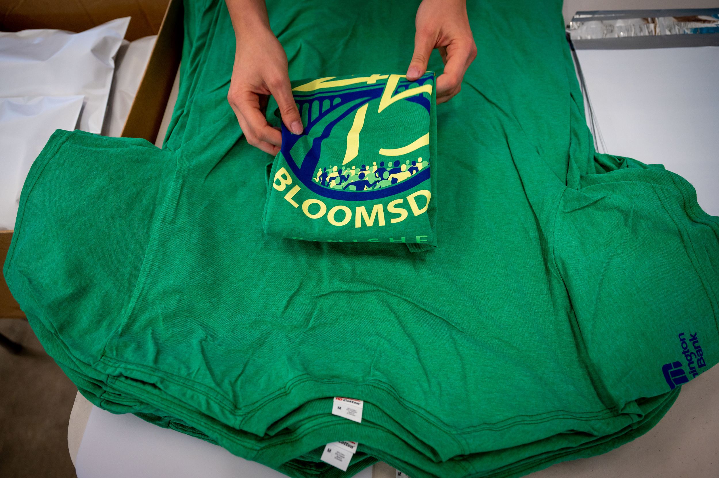 Bloomsday volunteers prep finisher Tshirts to mail across the world