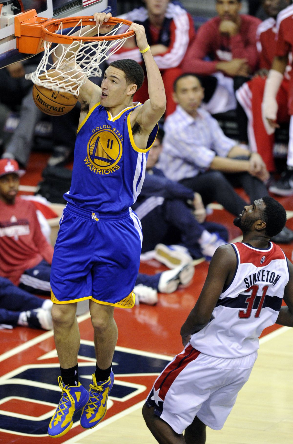 Klay Thompson throws down a dunk, but the former Cougar has worked hard on his defense. (Associated Press)