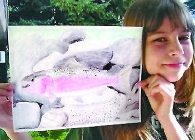 
Cassia Fox, 9, of Spokane displays her State-Fish Art contest-winning steelhead. 
 (Photo courtesy of Dan Fox / The Spokesman-Review)