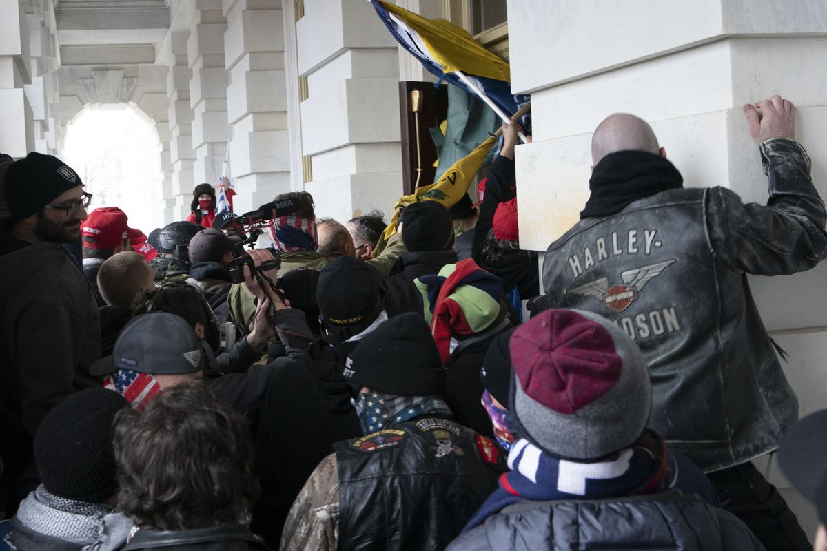 In this Jan. 6, 2021 photo, insurrectionists loyal to President Donald Trump try to open a door of the U.S. Capitol as they riot in Washington. New internal documents provided by former Facebook employee-turned-whistleblower Frances Haugen provide a rare glimpse into how the company, after years under the microscope for the policing of its platform, appears to have simply stumbled into the Jan. 6 riot  (Jose Luis Magana)