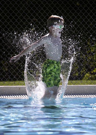 
Mathew Mamza, 8, jumps into the water during the Level II swimming lesson at Terrace View Park pool in the Spokane Valley on Monday, the first day of swimming lessons. The lessons run for two weeks. 
 (Liz-Anne Kishimoto / The Spokesman-Review)