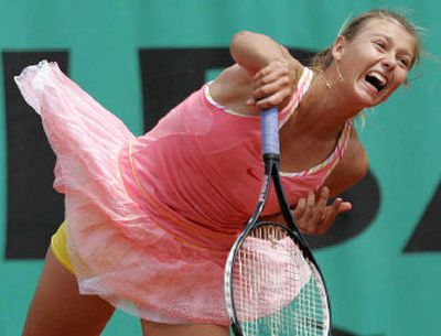 
Maria Sharapova serves to Dinara Safina during Safina's three-set victory at the French Open. 
 (Associated Press / The Spokesman-Review)