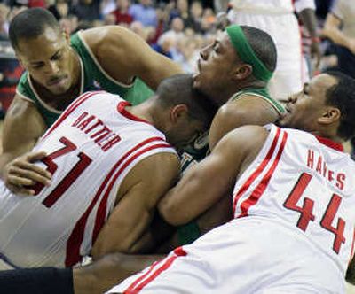 
Chuck Hayes, right, and Shane Battier of the Houston Rockets battle Boston's Paul Pierce for a loose ball. Associated Press
 (Associated Press / The Spokesman-Review)