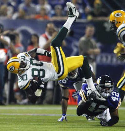 
Green Bay Packers wide receiver Donald Driver (80) is upended. Associated Press
 (Associated Press / The Spokesman-Review)