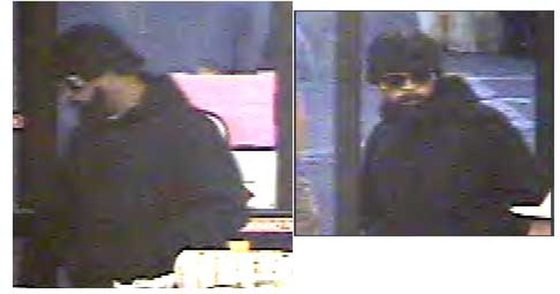 Surveillance camera images of a man who robbed the Grocery Outlet on North Division Street in Spokane on Tuesday, June 23, 2009. (Courtesy of Spokane Police Department)