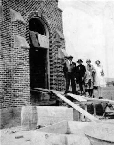 
Courtesy of Spokane Valley Historical Museum Left, church members posed for a photograph on the front steps of the Spokane Valley Baptist Church at Sprague and Union while it was under construction in the spring of 1928. The old church burned down in October 1927 and this church was complete nine months and eight days after the fire.
 (Courtesy of Spokane Valley Historical Museum / The Spokesman-Review)