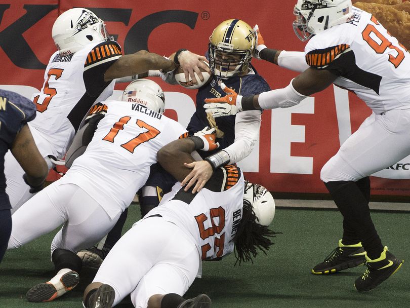 Fever quarterback Pat McCain (4) is sacked for a loss during the first half an IFL arena football game, Friday, April 29, 2016, in the Spokane Arena. (Colin Mulvany / The Spokesman-Review)