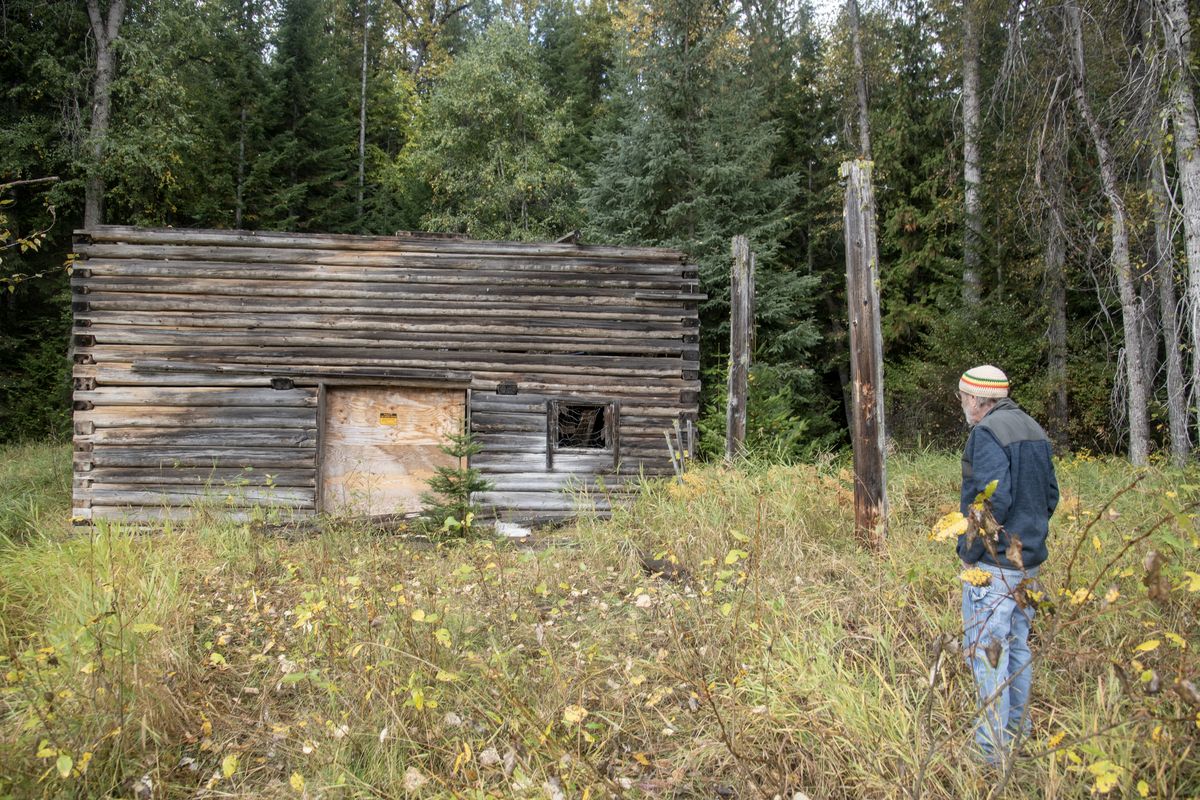 Carlos Landa looks at an old barn that was part of the Bismark ranger station near Nordman, Idaho, last month.  (Michael Wright/THE SPOKESMAN-REVIEW)