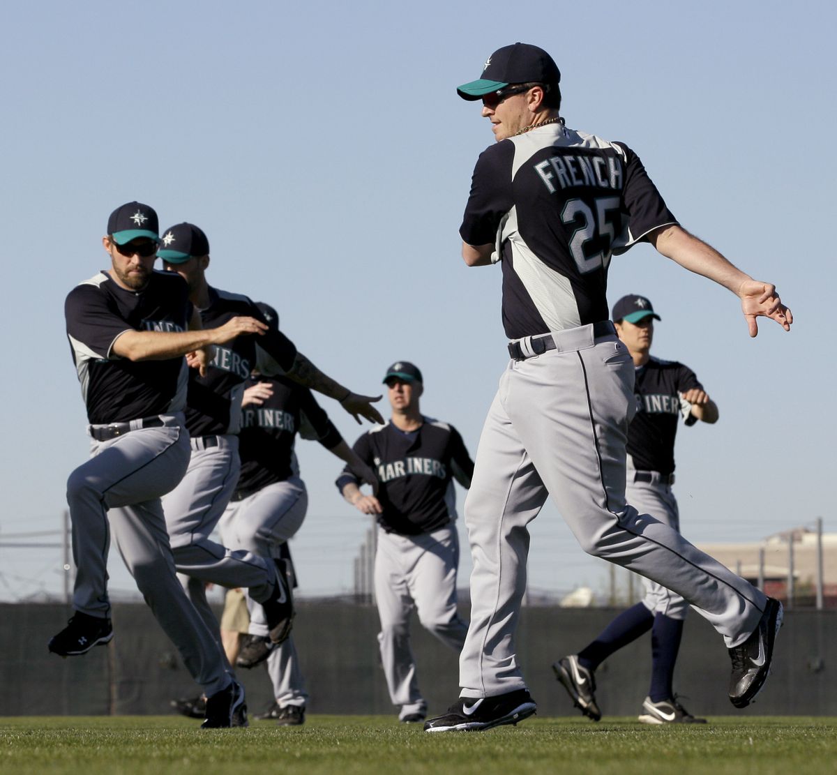 Seattle Mariners pitcher Luke French (25) and other players participate in a drill during baseball spring training Monday, Feb. 14, 2011, in Peoria, Ariz. (Charlie Riedel / Associated Press)