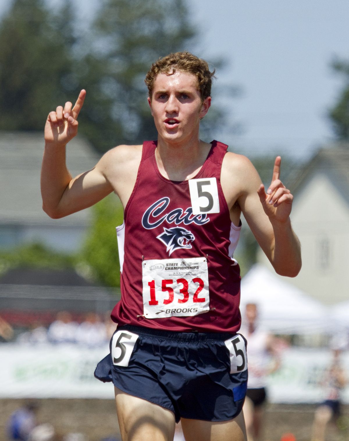 Mt. Spokane’s John Dressel crosses the finish line in the 3A 3,200 meters and completes a distance double. (Patrick Hagerty)