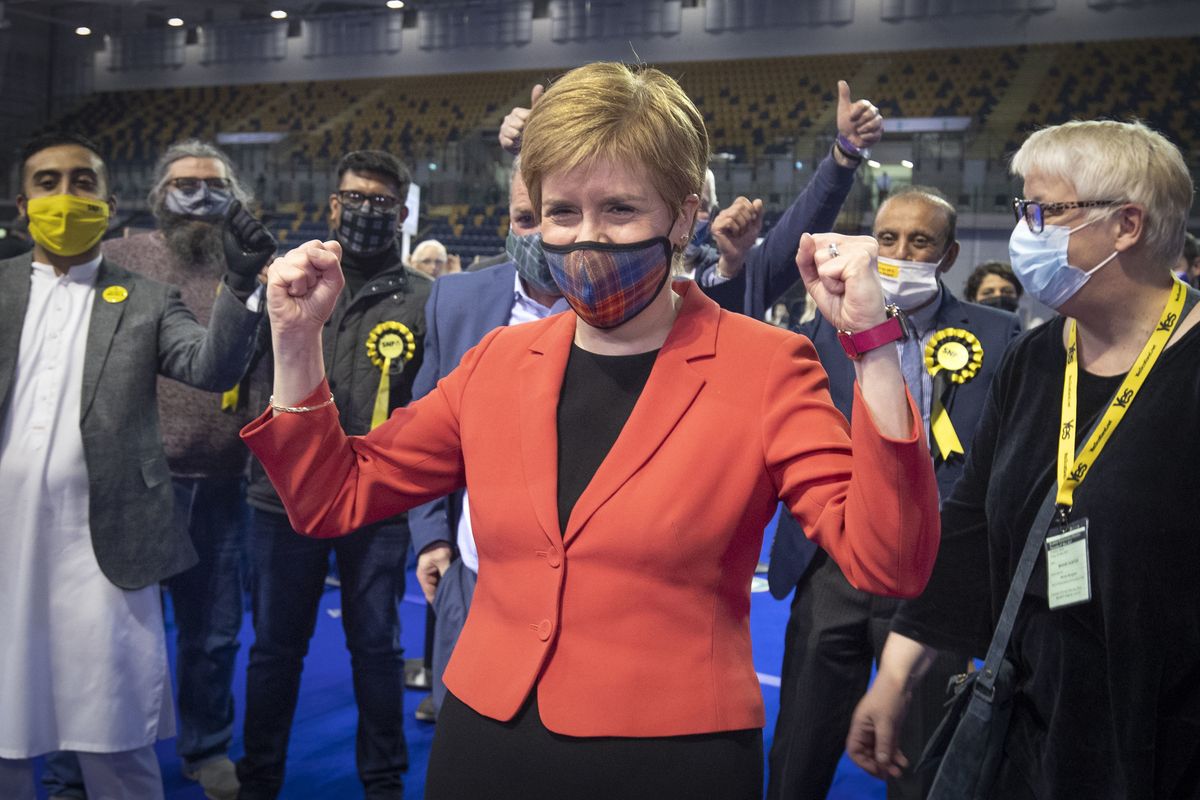 First Minister and SNP party leader Nicola Sturgeon celebrates after retaining her seat for Glasgow Southside at the count for the Scottish Parliamentary Elections in Glasgow, Scotland, Friday May 7, 2021. On winning her seat in Glasgow, Nicola Sturgeon, said early results indicated that her party was on course to win its fourth straight election in Scotland but that the final outcome would not emerge until Saturday evening.  (Jane Barlow)