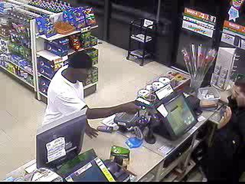 
A reward is being offered for tips that help identify a man who robbed a Spokane convenience store at gunpoint early Saturday.
Surveillance photos released today show the man pointing a gun at a clerk at 7-Eleven, 1425 N. Maple St., about 4:30 a.m.
The robber is described as 5-foot-6 and 180 pounds, and in his late 20s or early 30s.
Anyone with information is asked to call 1-800-222-TIPS or submit tips <a href=