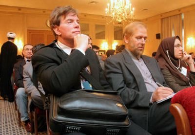
David Duke, left, a former leader of the  Ku Klux Klan and former Louisiana state representative, listens to a speech during a conference of  Holocaust deniers in Tehran, Iran, on Tuesday. 
 (Associated Press / The Spokesman-Review)