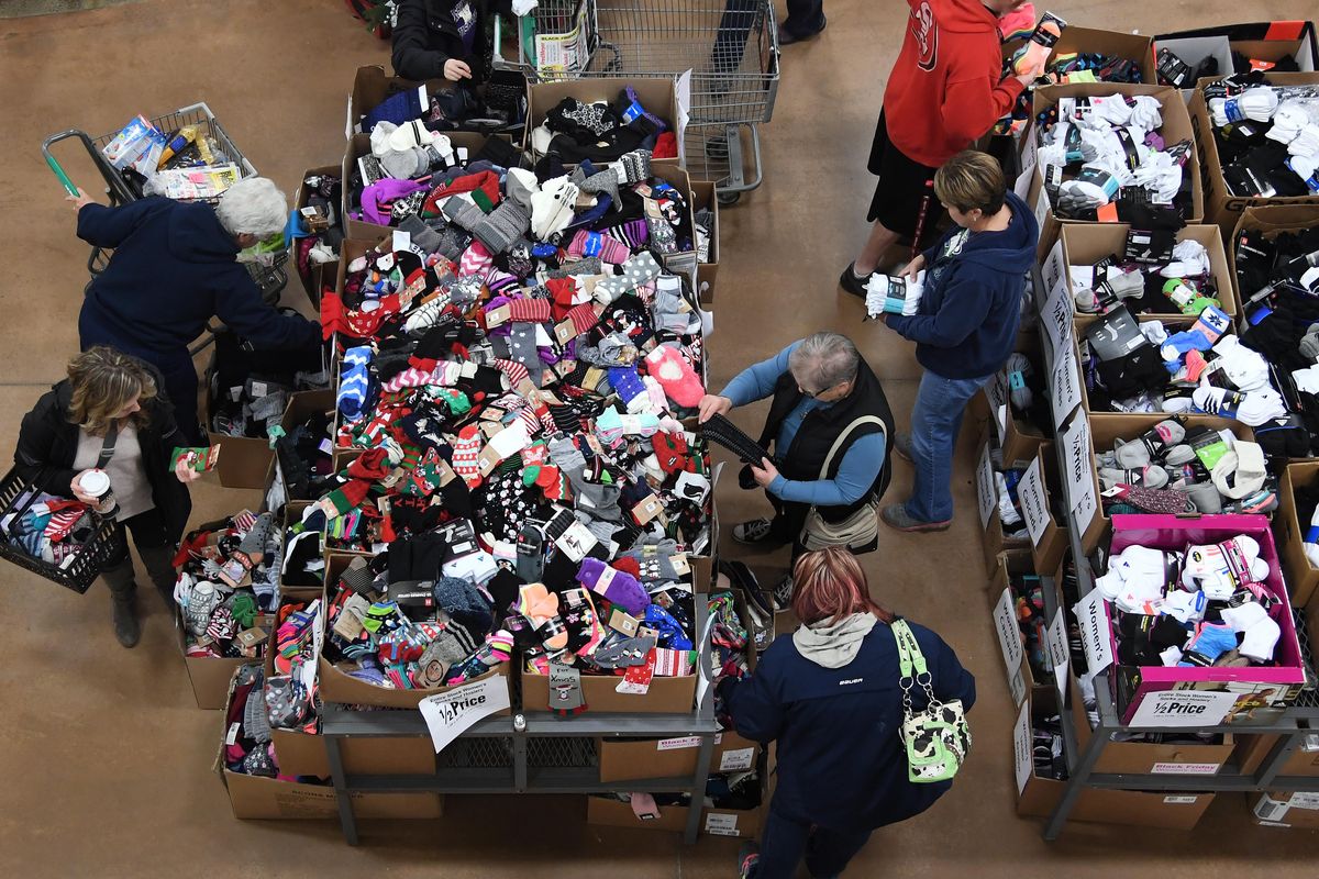 Shoppers check out the Black Friday deal on socks at Fred Meyer in East Central Friday, Nov. 25, 2016. (Colin Mulvany / The Spokesman-Review)